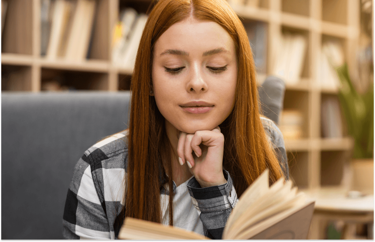 young-woman-laying-on-the-grass-working-on-laptop-students-studying-university